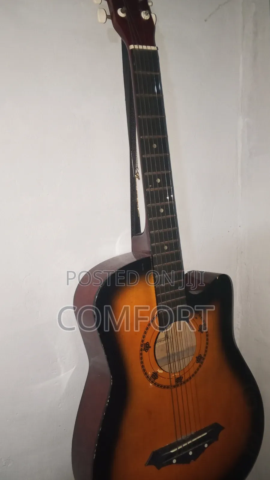 Neat Looking Acoustic Guitar With All Components Functioning Well.