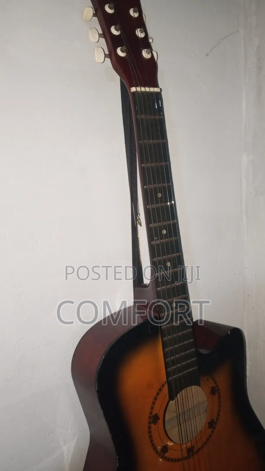 Neat Looking Acoustic Guitar With All Components Functioning Well.