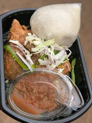 Assorted Jollof Rice With Spicy Wings and Served Fried Plantain