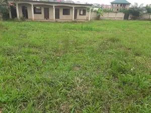 Main Road Double Plot for Sale at Mamponteng