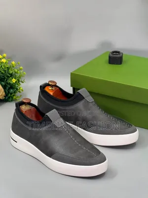 Gray and White Timberland Brand Full Grain Leather Sneakers