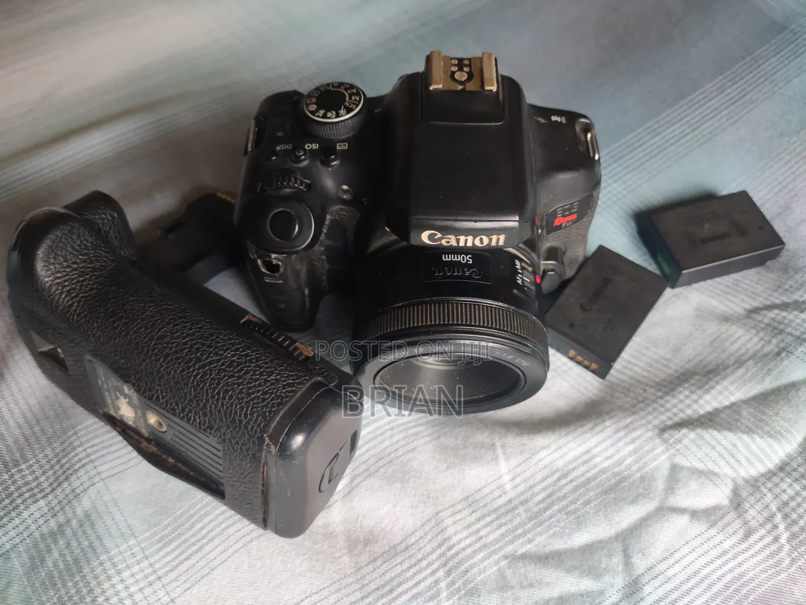 Canon T6i (Dark Region Around the Screen) + 50mm Prime Lens+ Batt Grip