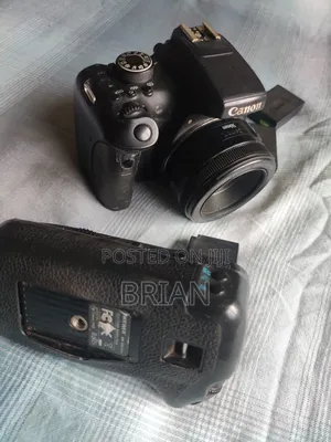 Canon T6i (Dark Region Around the Screen) + 50mm Prime Lens+ Batt Grip