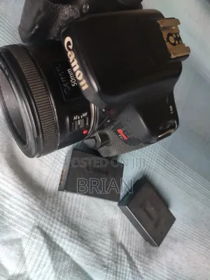 Canon T6i (Dark Region Around the Screen) + 50mm Prime Lens+ Batt Grip