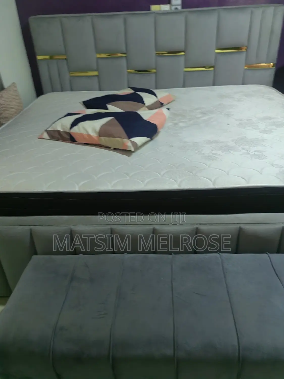 Bed With Two Dressers and a Sofa