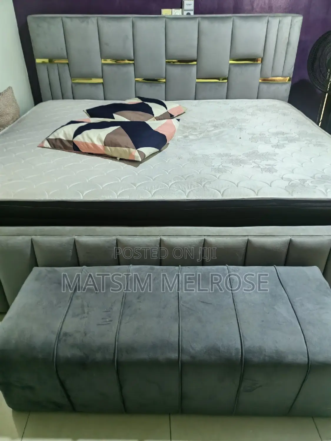 Bed With Two Dressers and a Sofa