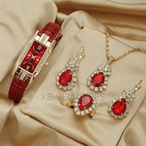 A Set of Accessories Includinga a Pair of Earrings, Necklace, Ring