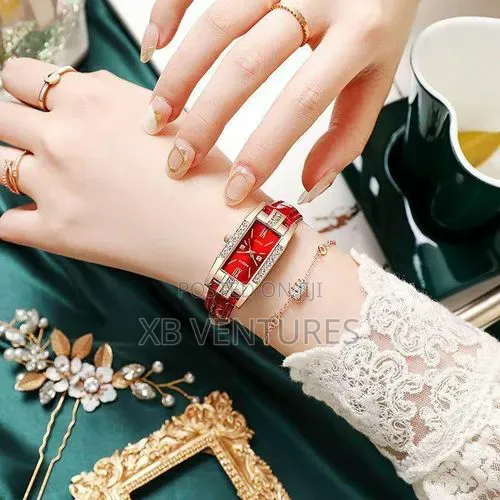 A Set of Accessories Includinga a Pair of Earrings, Necklace, Ring