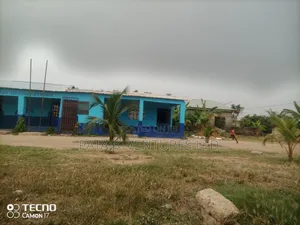 Two Plots Of Land With 6 Classroom Blocks, An Office