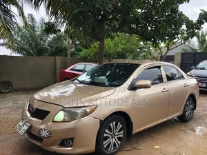 Toyota Corolla Base 4dr Sedan (1.8L 4cyl 5M) 2010 Brown