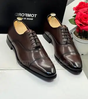 Brown Cap-Toe Oxford Shoes Feature a Polished Leather