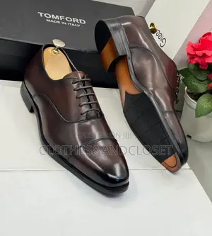 Brown Cap-Toe Oxford Shoes Feature a Polished Leather