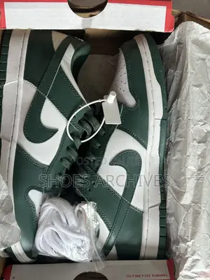 These Nike Original Dunk Low Sneakers in the "Team Green" Colorway