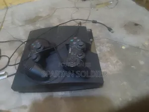 Ps3 Slim With 2 Controllers and 10 Games
