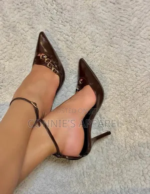 Gold Stiletto Slingback Heels With a Pointed Toe and Textured Finish