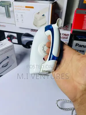 H E Portable Travel Steam Iron
