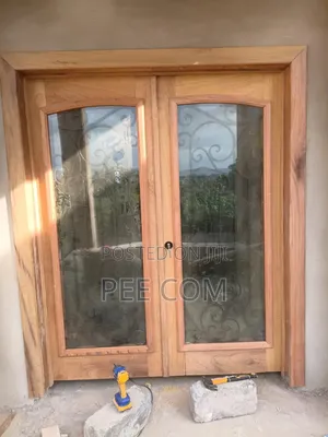 Special Wooden Door (With Metal Designing and Glass Framing )