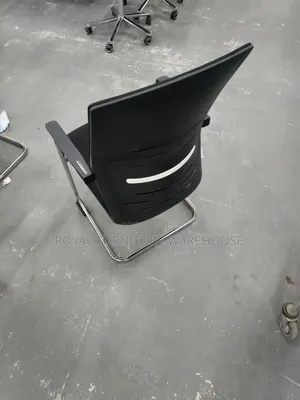 Black Cantilever Visitor's Or Conference Chair With A Chrome Frame.