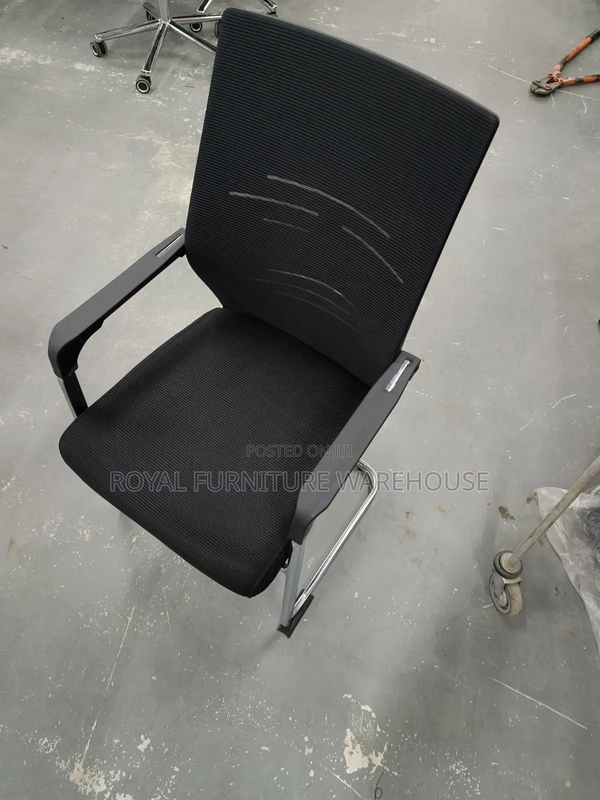 Black Cantilever Visitor's Or Conference Chair With A Chrome Frame.