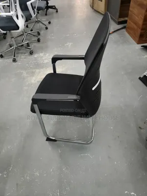 Black Cantilever Visitor's Or Conference Chair With A Chrome Frame.
