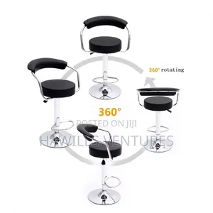 Swivel Bar Stool Featuring a Padded Seat and a Chrome Base.