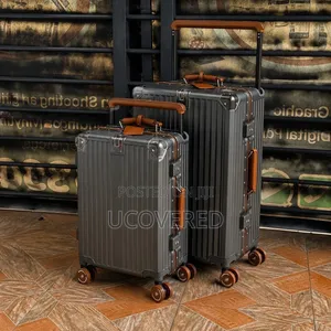 Hard-Shell Suitcases Feature a Wide-Handle Design