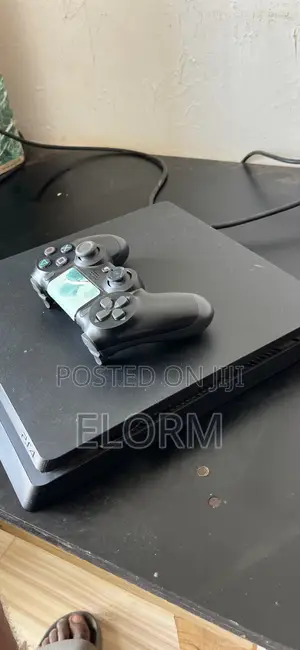 PS4 Slim With 2 Games(Fc26 and Mortal Kombat)