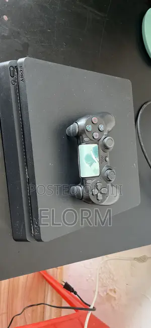 PS4 Slim With 2 Games(Fc26 and Mortal Kombat)
