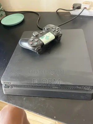 PS4 Slim With 2 Games(Fc26 and Mortal Kombat)