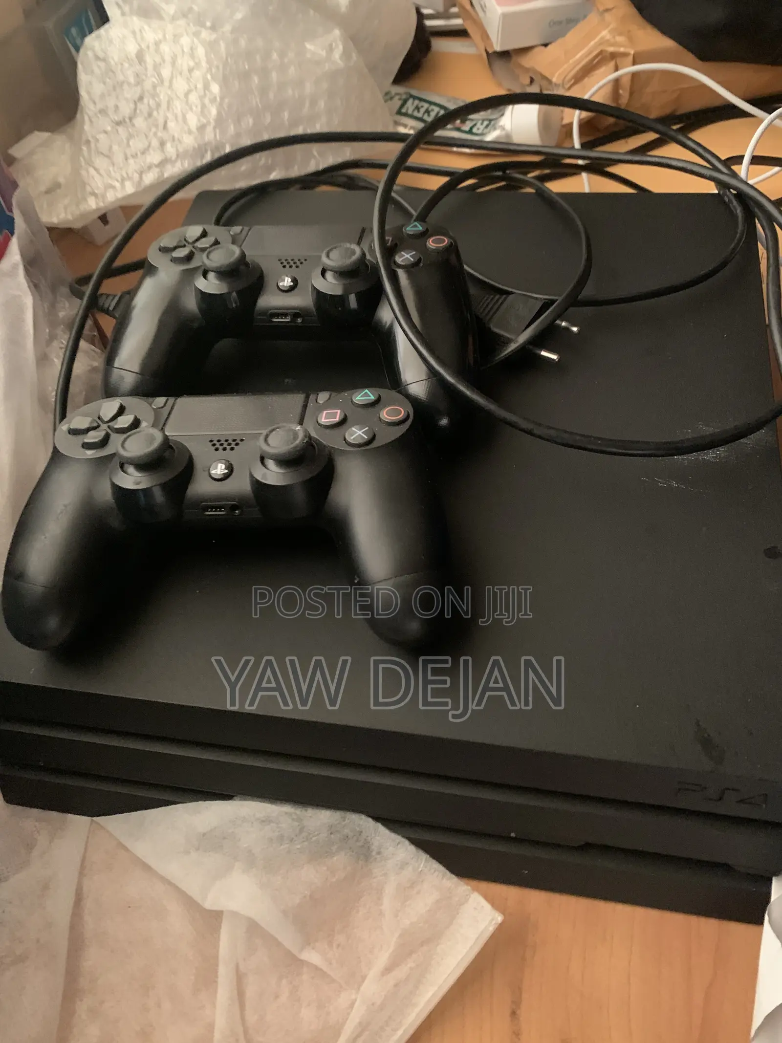 PS4 Pro (1TB) With 2 Controllers and 5 Games CDs and FC26 Installed)