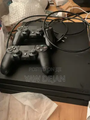 PS4 Pro (1TB) With 2 Controllers and 5 Games CDs and FC26 Installed)