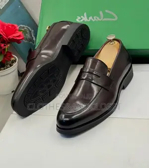 Clarks Black Leather Penny Loafers Featuring a Classic Slip-on Design