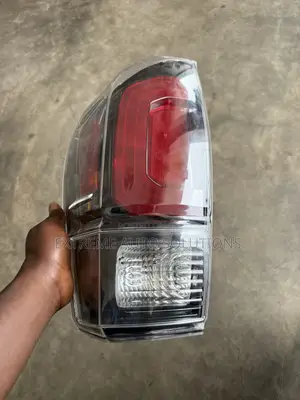 Genuine Toyota OEM TRD PRO Smoked Bezel Tail Light (LH)