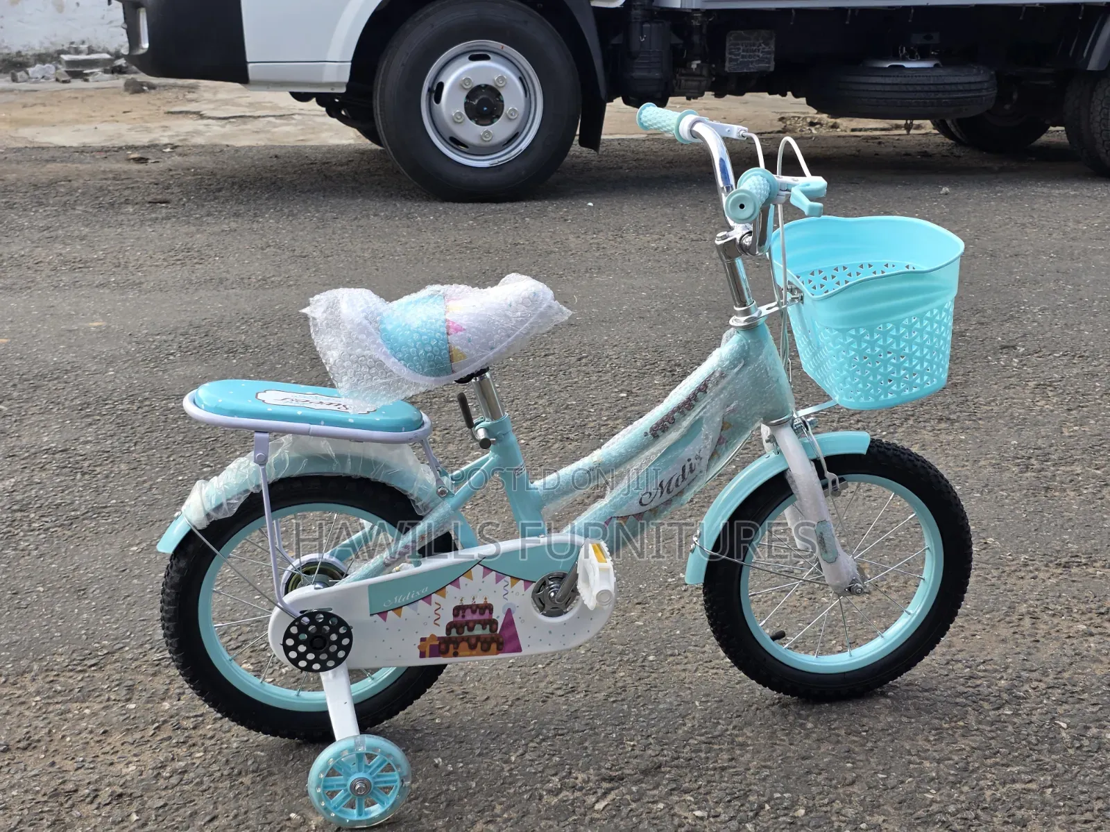 Light Blue Children's Bicycle Featuring a Training Wheels and Basket.