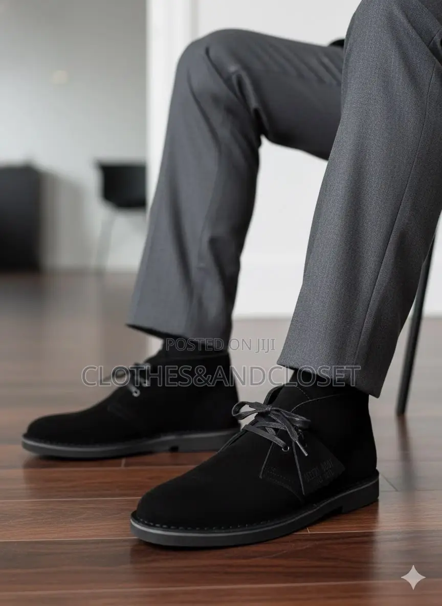 Clarks Desert Boots Feature a Black Suede Upper With Two-Eyelet Lacing