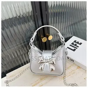 Metallic Bow Mini Handbag and Crossbody Strap
