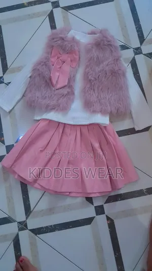 This Is a Three-Piece Children's Outfit Laid Out Flat,
