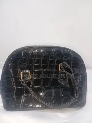 A Black Patent (Glossy) Crocodile-Embossed Handbag.