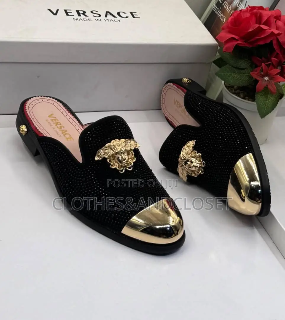 Versace Shoes Feature a Gold Toe Cap and a Medusa Emblem.