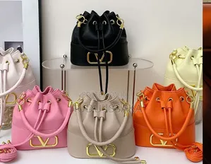 Hand Bags With a Golden Brand Logo for Women