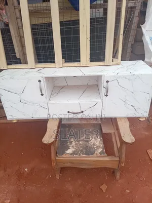 A Four Foot Neatly Used TV Stand. White Color