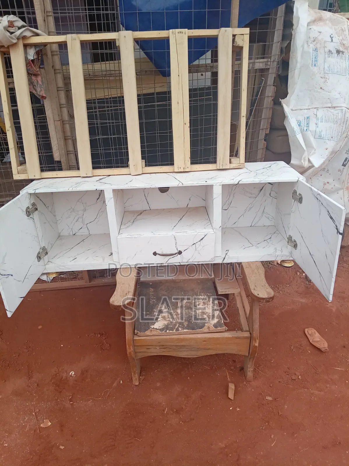 A Four Foot Neatly Used TV Stand. White Color