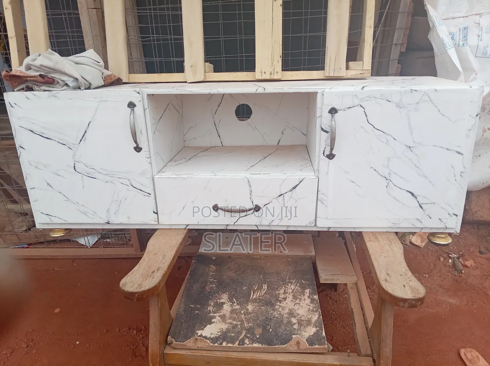 A Four Foot Neatly Used TV Stand. White Color