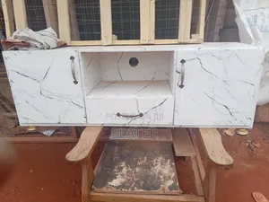 A Four Foot Neatly Used TV Stand. White Color