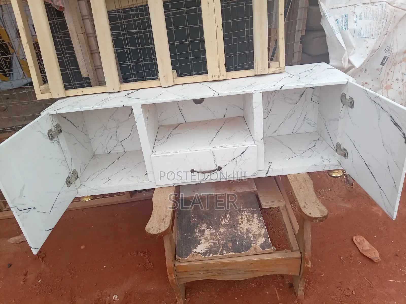 A Four Foot Neatly Used TV Stand. White Color