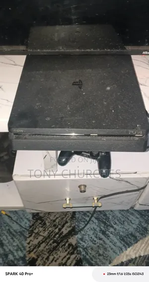 PS4 Slim With 3 Installed Games. FC 26, the Last of Us, and Other