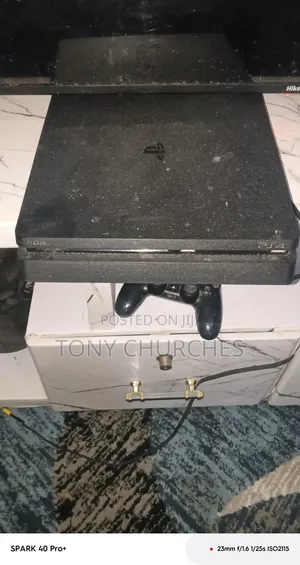 PS4 Slim With 3 Installed Games. FC 26, the Last of Us, and Other