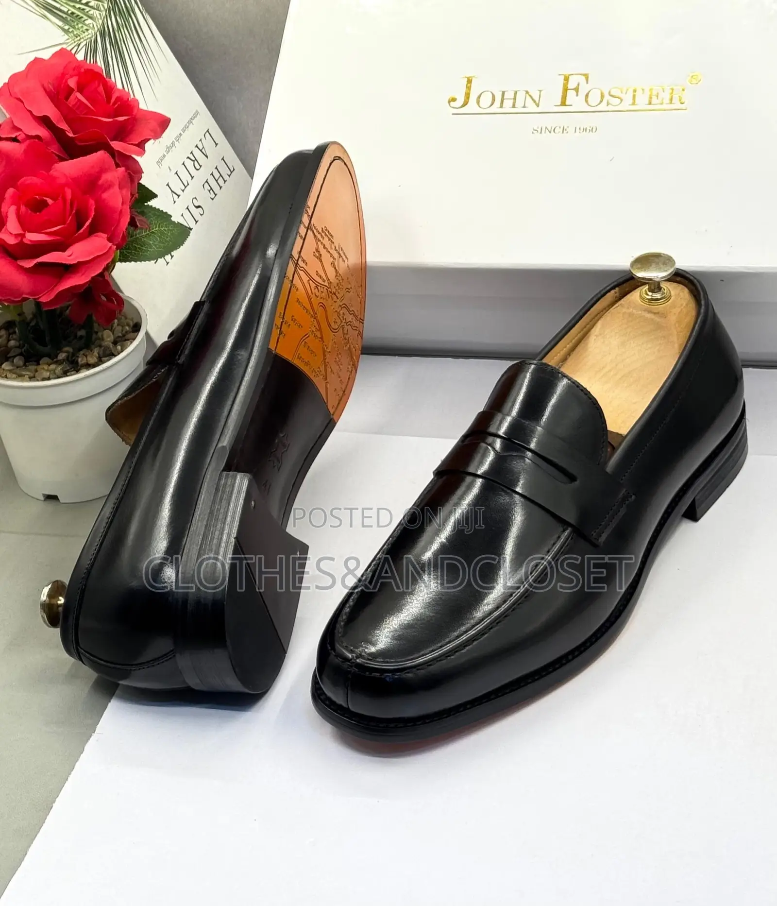 John Foster Black Leather Loafers Feature a Classic Penny Slot Design