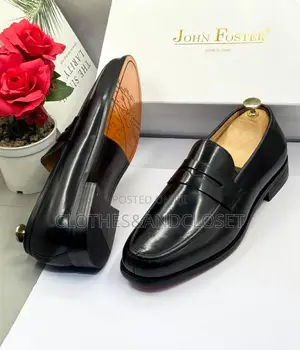 John Foster Black Leather Loafers Feature a Classic Penny Slot Design