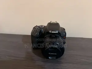 Canon EOS 200D Camera Body With 3 Lenses and a Godox Flash Light.